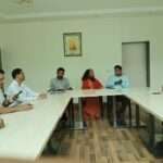 Saraswati Maharaj and health department officials