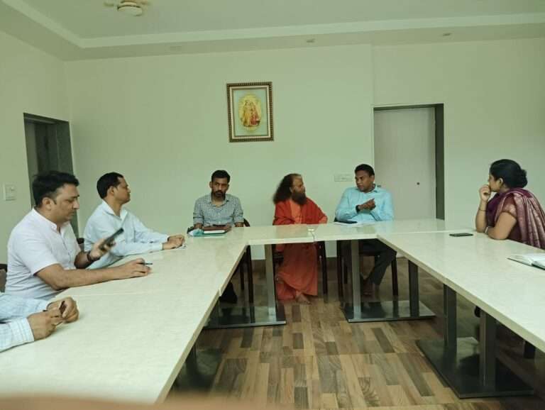 Saraswati Maharaj and health department officials